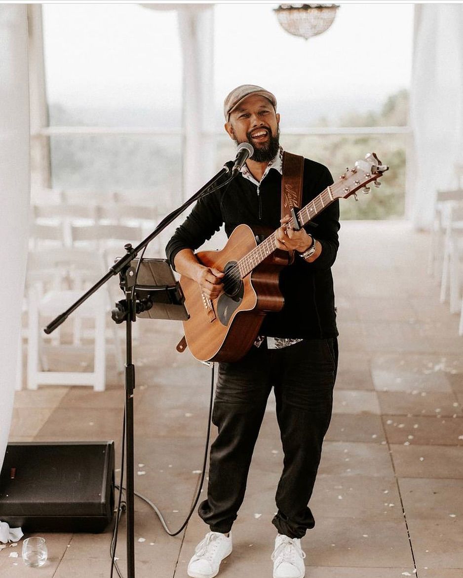 John performing at a wedding ceremony